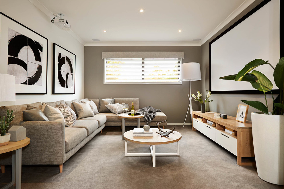 Abgetrenntes Modernes Heimkino mit grauer Wandfarbe, Teppichboden, Leinwand und grauem Boden in Melbourne