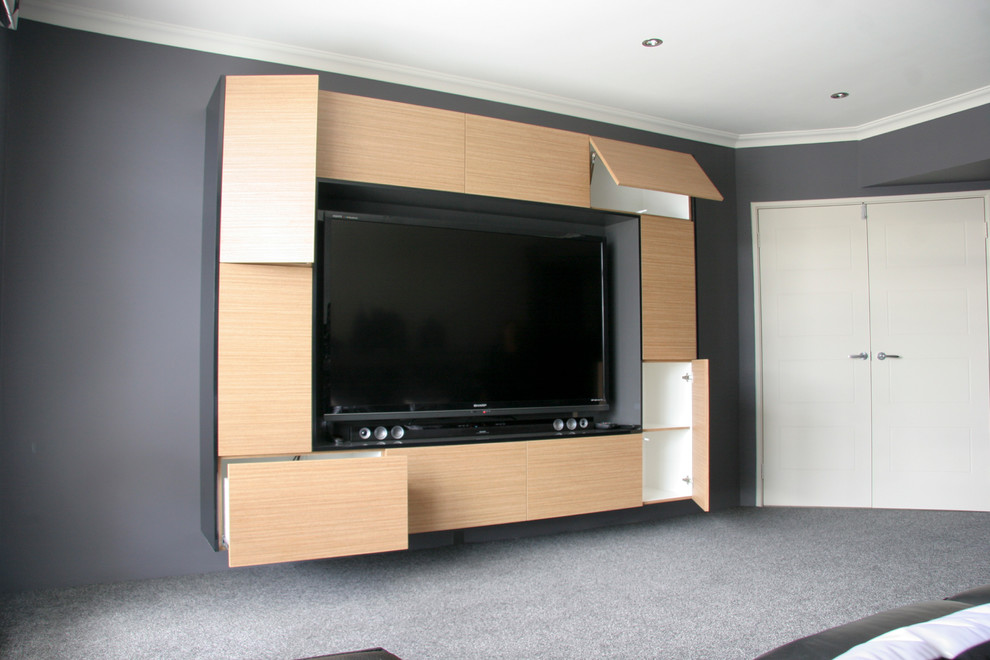 Inspiration for a large industrial enclosed carpeted and gray floor home theater remodel in Perth with gray walls