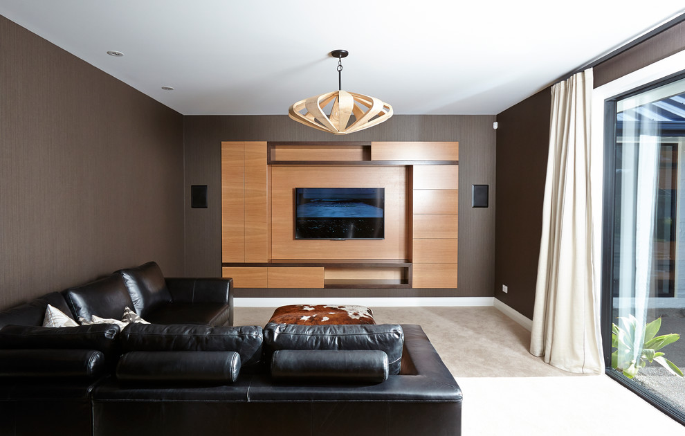 Design ideas for a large contemporary home cinema in Hamilton with brown walls, carpet and a built-in media unit.