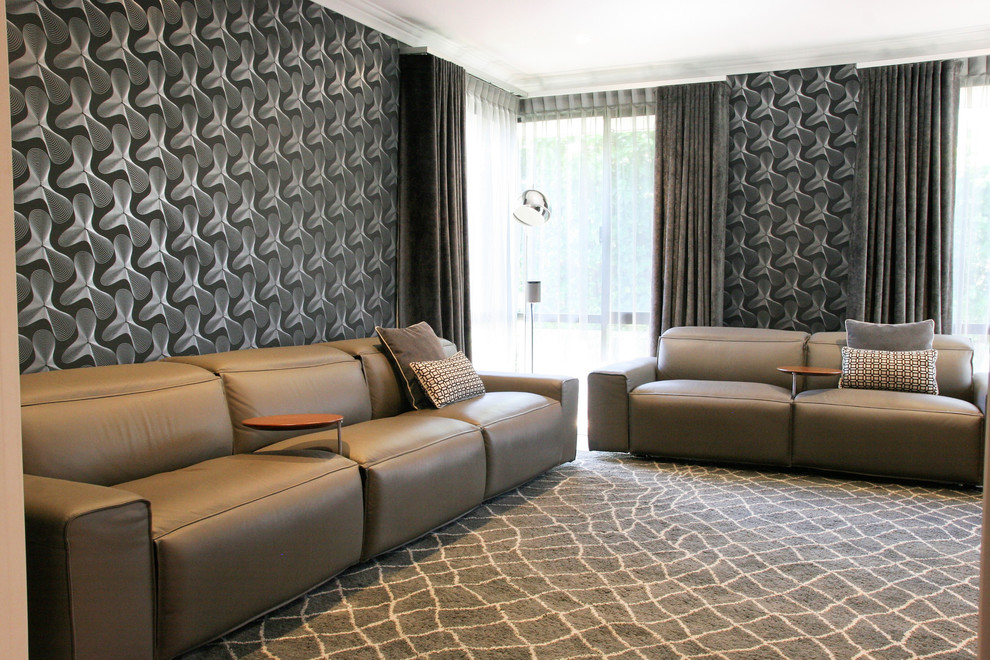 Large contemporary enclosed home cinema in Perth with black walls, carpet, a wall mounted tv and grey floors.