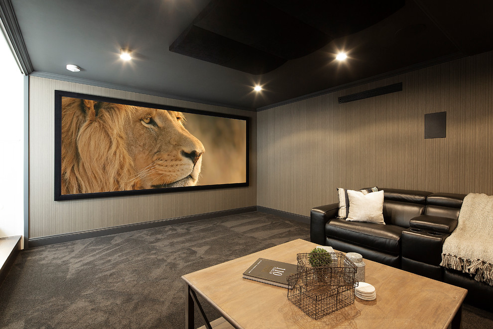 Example of a mid-sized beach style enclosed carpeted and gray floor home theater design in Brisbane with brown walls and a media wall