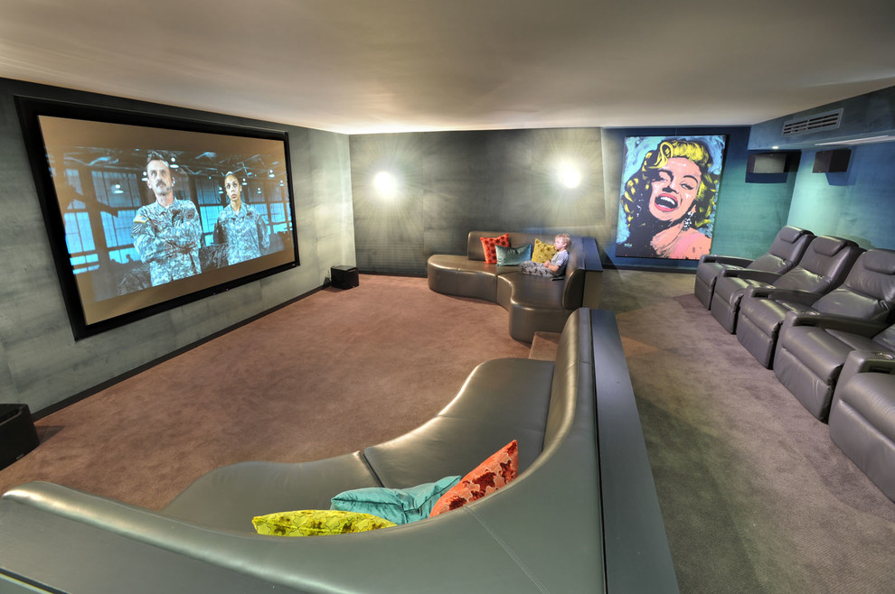 Home theater - large contemporary enclosed carpeted and gray floor home theater idea in Melbourne with gray walls and a projector screen