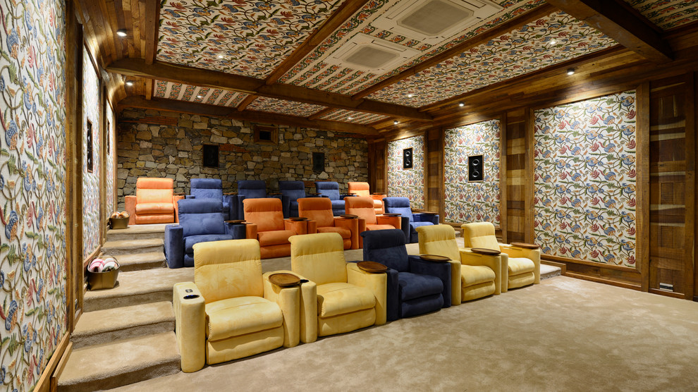 Inspiration for a large traditional home cinema in Mumbai with carpet and a projector screen.