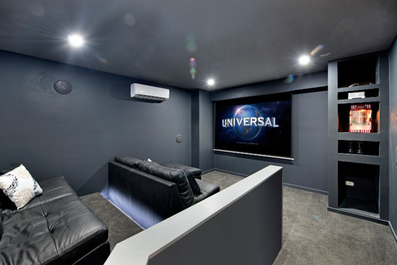 Mid-sized trendy enclosed carpeted home theater photo in Brisbane with gray walls and a projector screen