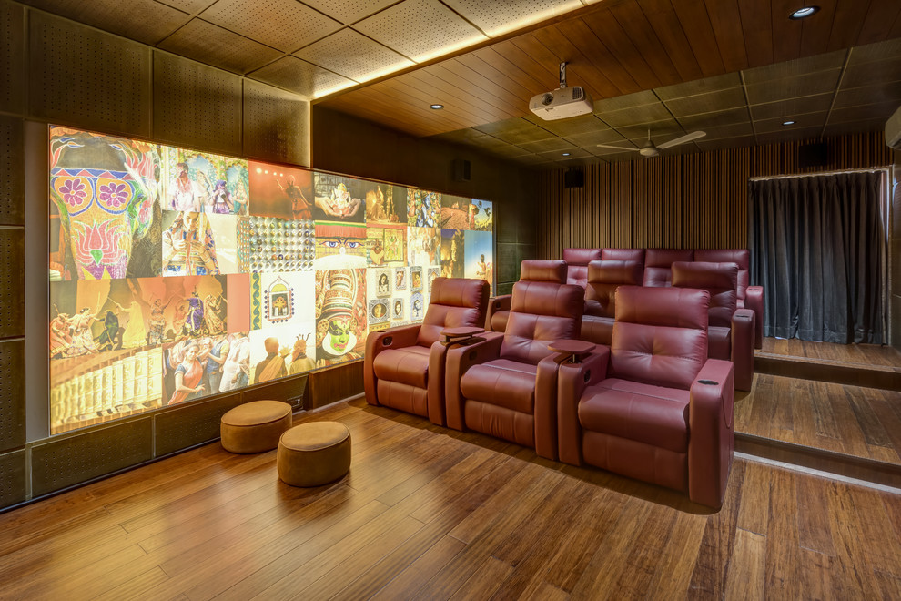Design ideas for a world-inspired enclosed home cinema in Other with brown floors.