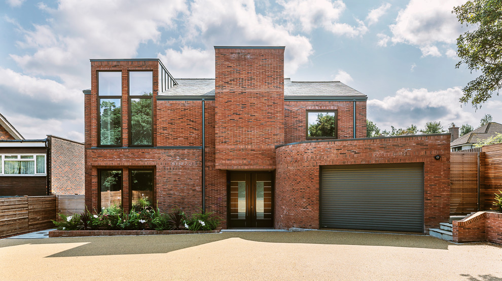 This is an example of a large contemporary brick detached house in London.