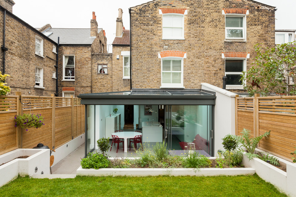Inspiration for a contemporary rear extension in London with three floors.