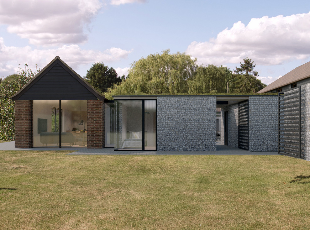 Réalisation d'une façade de maison grise design en pierre de taille moyenne et de plain-pied avec un toit plat et un toit végétal.