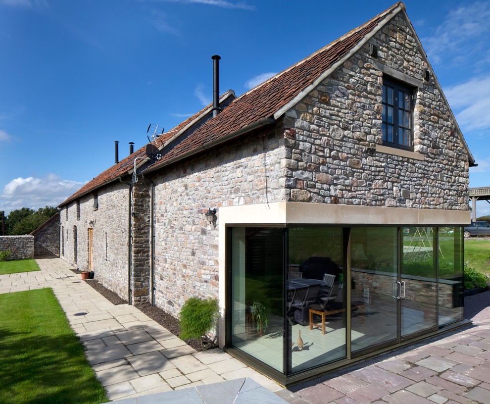 Inspiration for a transitional two-story exterior home remodel in Gloucestershire