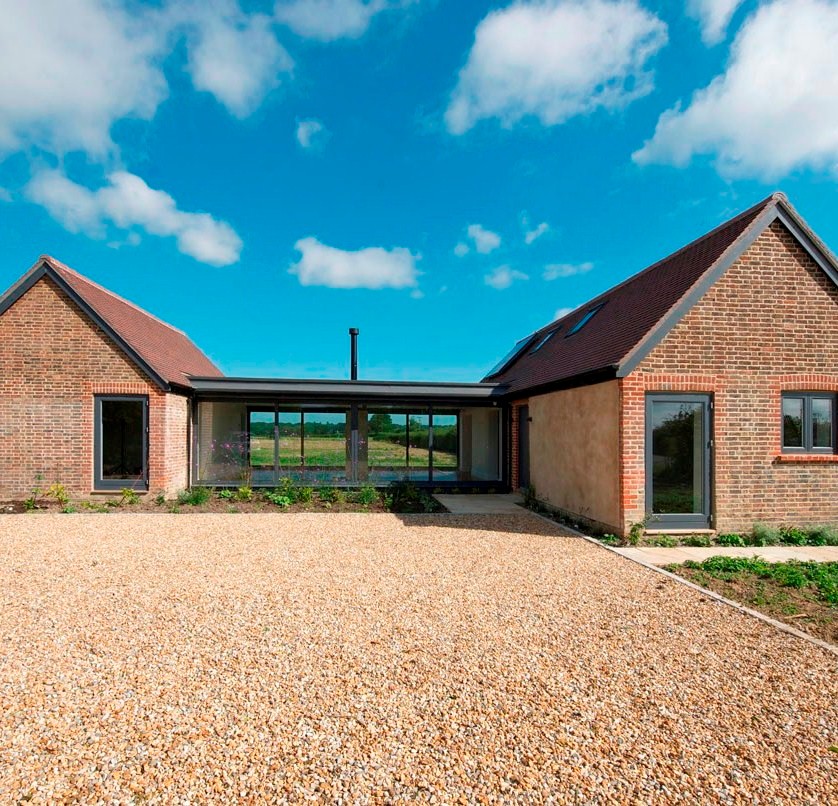 Inspiration for a large contemporary bungalow brick detached house in Kent with a pitched roof.