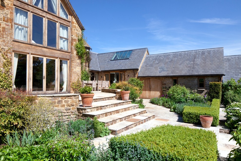 Farmhouse two floor house exterior in Gloucestershire with a pitched roof.