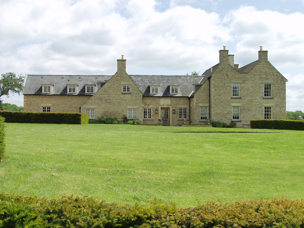 This is an example of a large classic two floor house exterior in Oxfordshire with stone cladding.