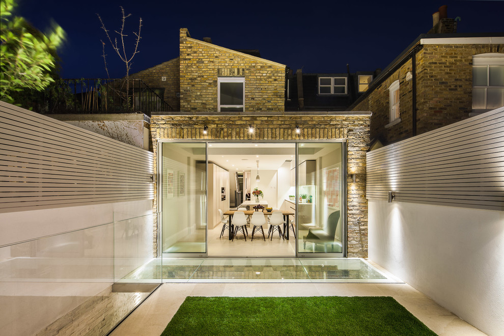 Contemporary split-level brick house exterior in London.