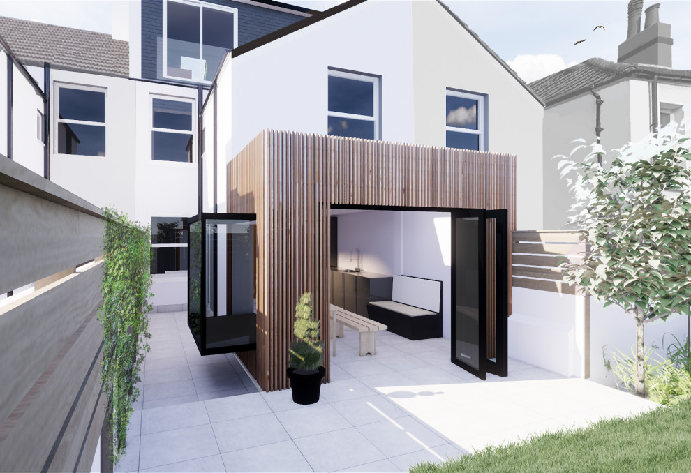 Kleines, Dreistöckiges Modernes Haus mit weißer Fassadenfarbe und Flachdach in Sussex