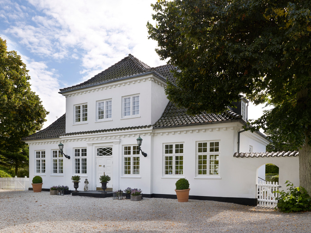 Large and white traditional two floor house exterior in Copenhagen.