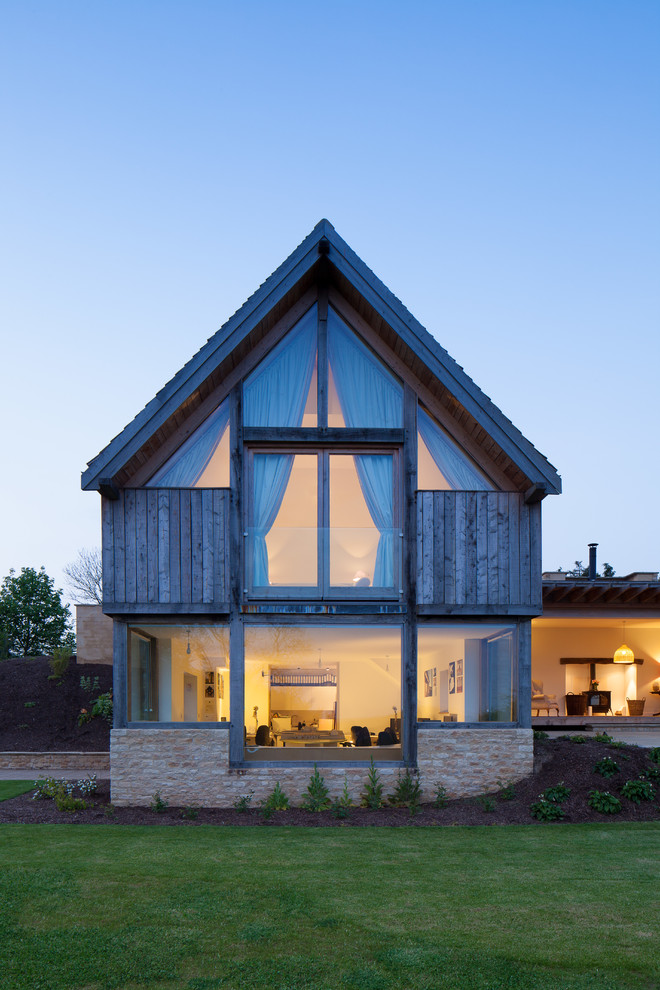Inspiration for a contemporary two floor house exterior in Gloucestershire with mixed cladding.