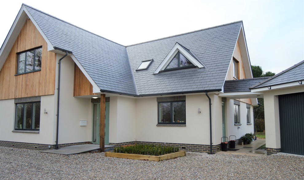 Inspiration for a contemporary two floor detached house in Kent with mixed cladding.