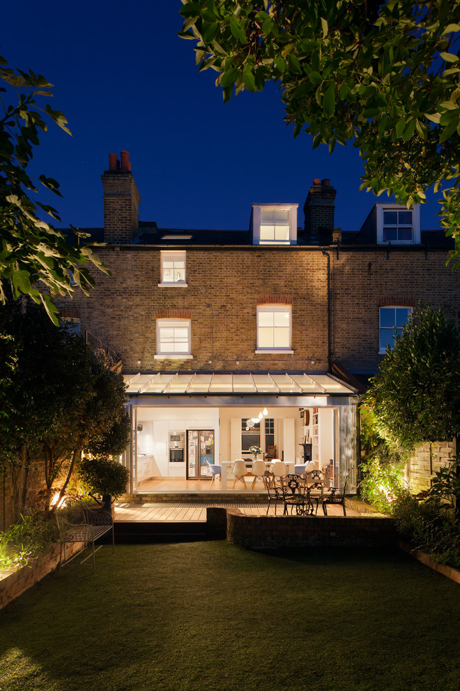 Design ideas for a contemporary brick and rear extension in London with three floors.