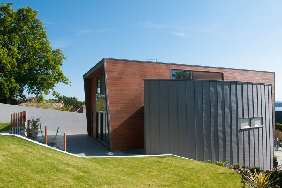 Design ideas for a contemporary house exterior in Dorset.