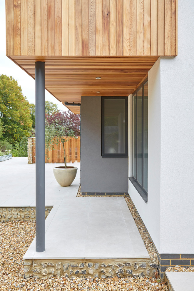 Inspiration for a large contemporary two floor detached house in Berkshire with wood cladding.