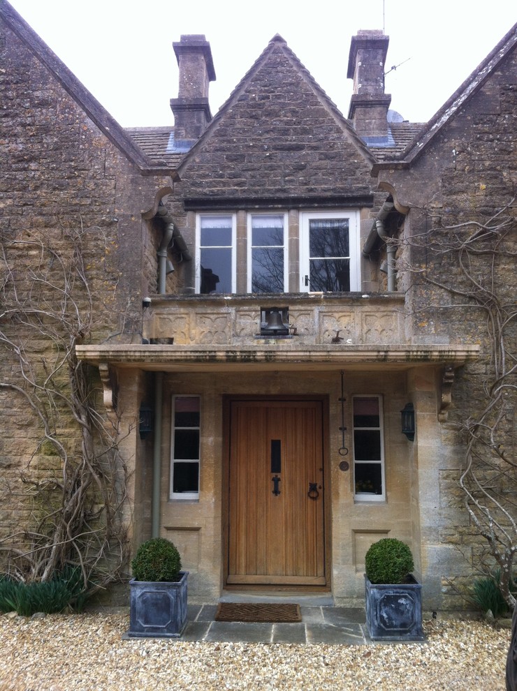 Photo of a rural two floor house exterior in Oxfordshire with stone cladding.
