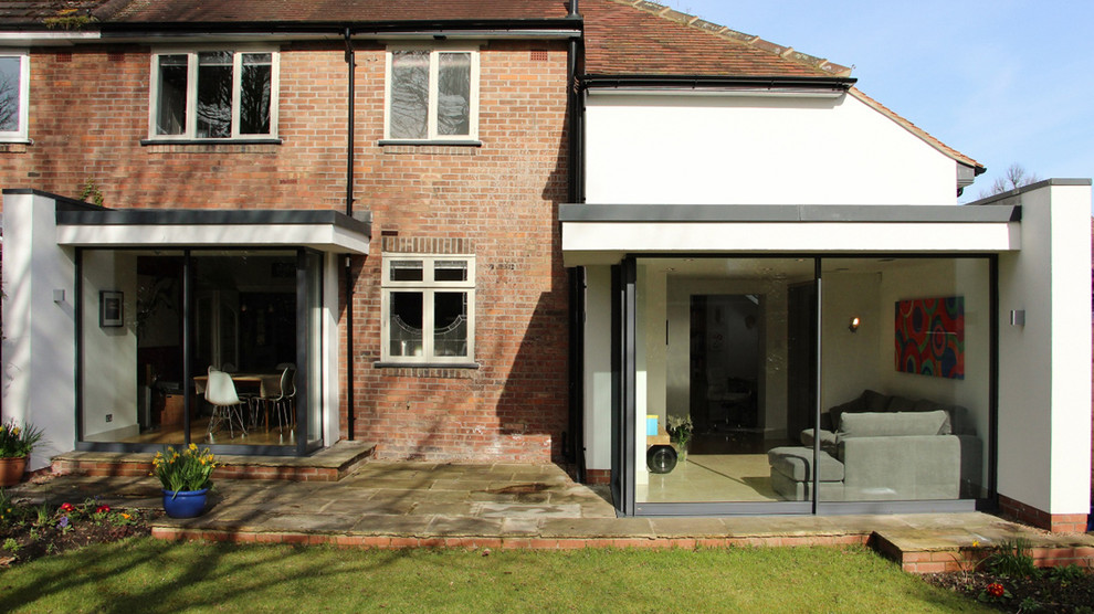 Medium sized and white contemporary two floor render house exterior in Other with a hip roof.
