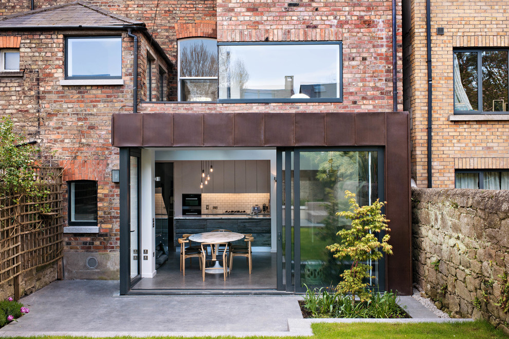 Inspiration for a contemporary brick house exterior in Dublin.