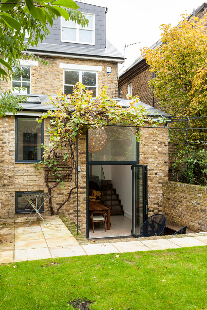 This is an example of a classic brick house exterior in London with three floors.