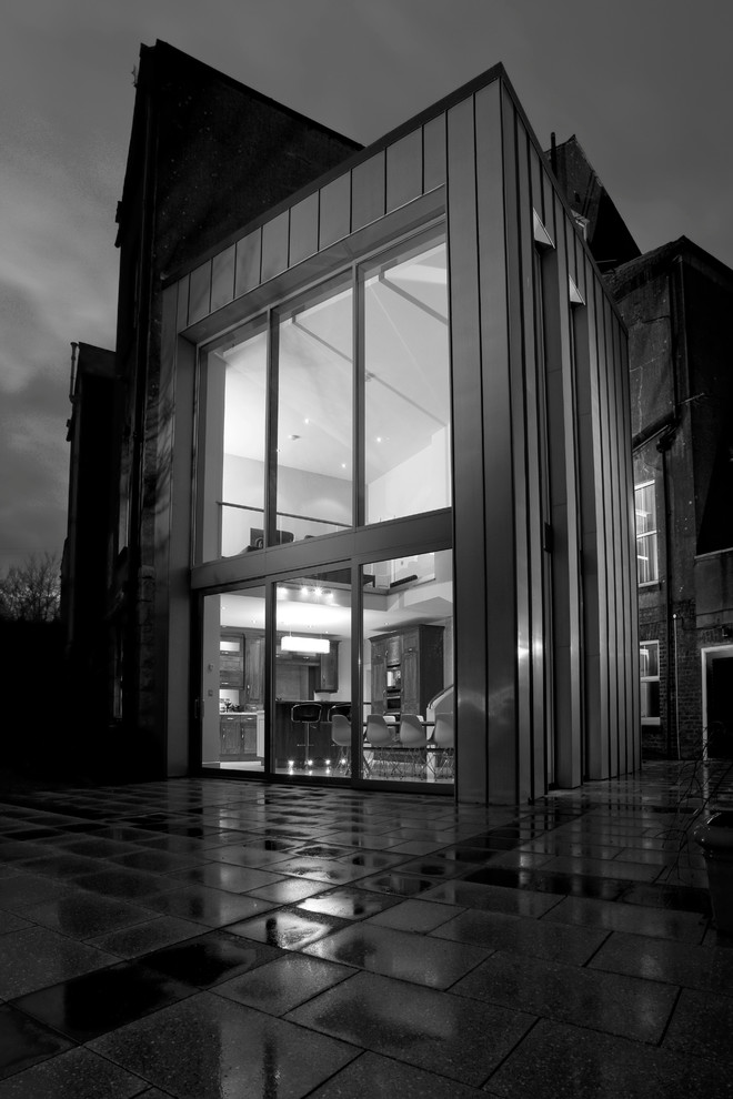 Double height zinc clad kitchen extension to gable of Victorian