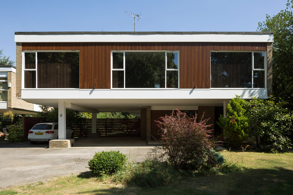 Inspiration for a mid-century modern exterior home remodel in Essex