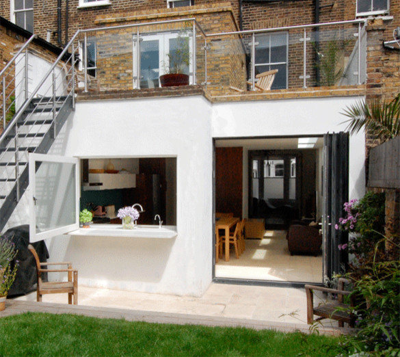 Photo of a medium sized contemporary house exterior in London with three floors.