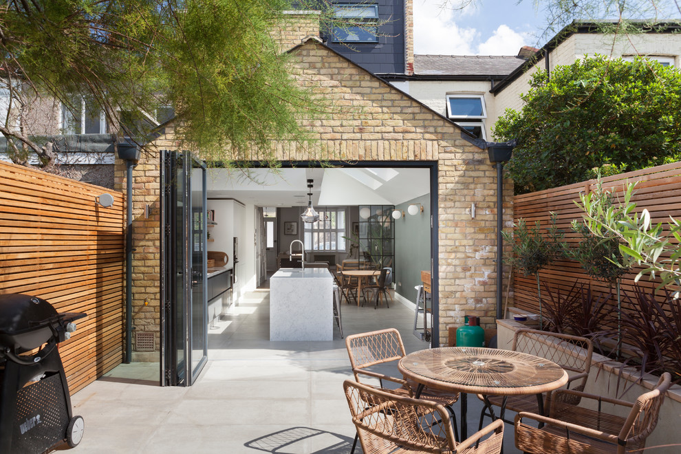 Inspiration for a medium sized contemporary brick house exterior in London.