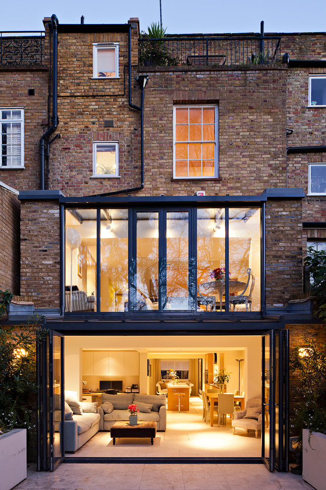 Inspiration for an industrial brick exterior home remodel in London