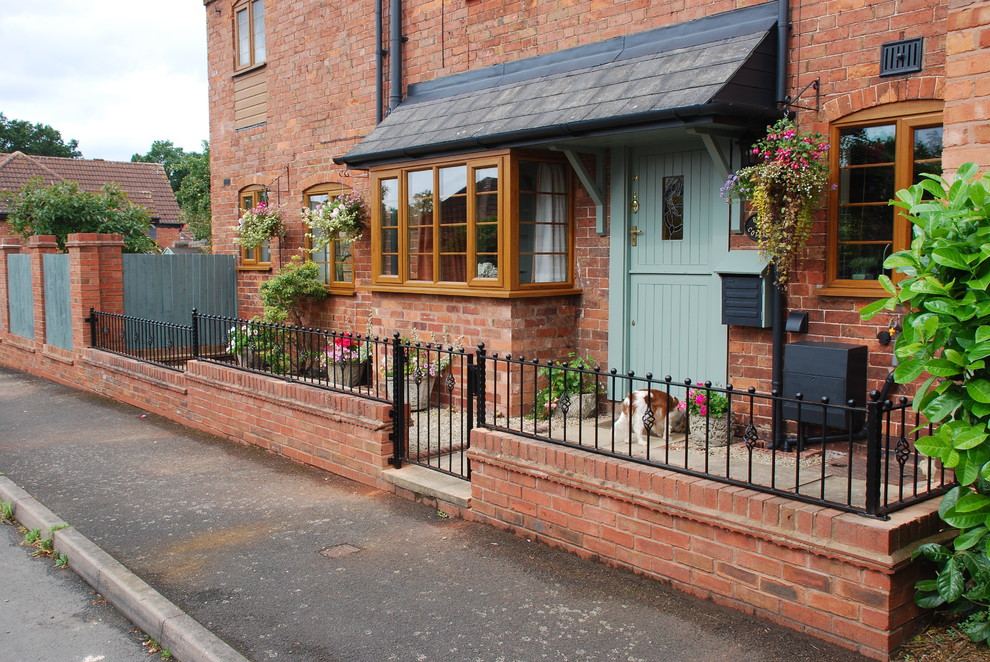 This is an example of a traditional brick house exterior in Other.