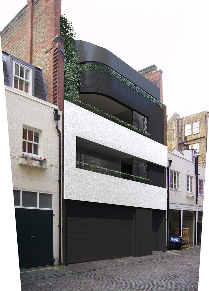 Inspiration for a black contemporary house exterior in London with three floors.
