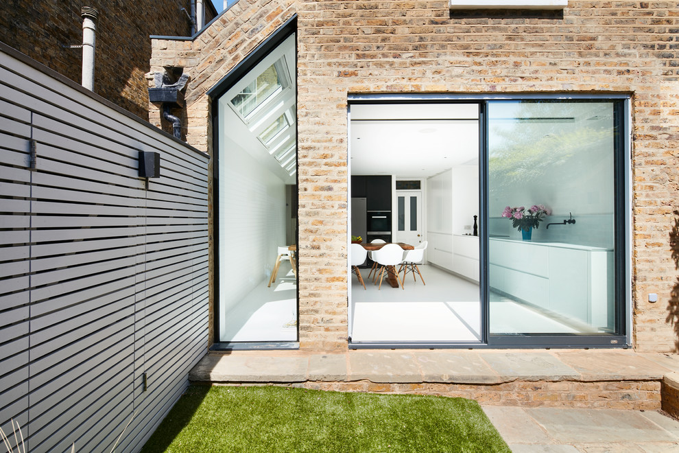 This is an example of a large contemporary house exterior in London.