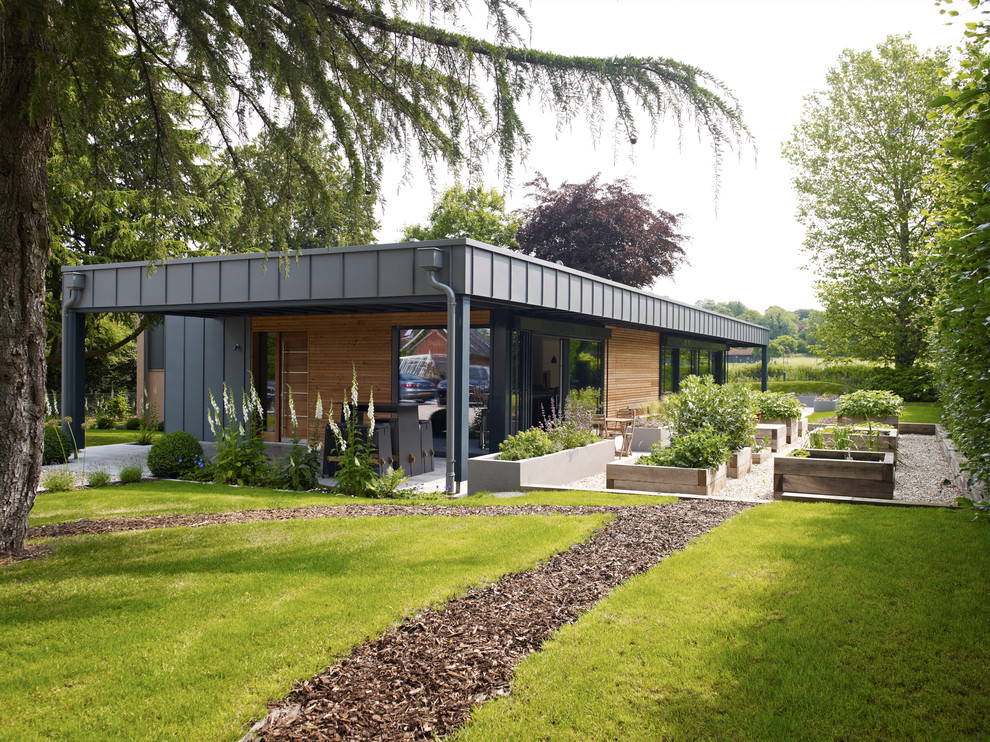 Contemporary bungalow extension in Hampshire with metal cladding.