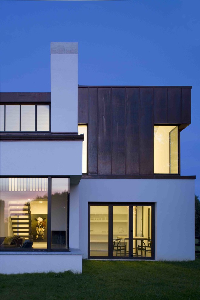 This is an example of a large and white modern house exterior in Dublin with metal cladding.