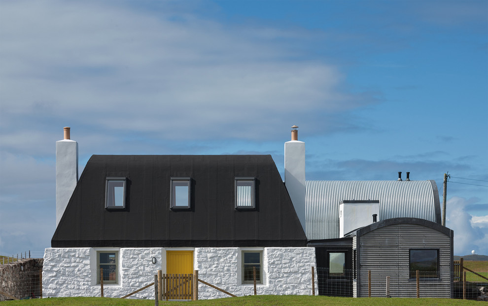 Contemporary white two-story mixed siding exterior home idea in London