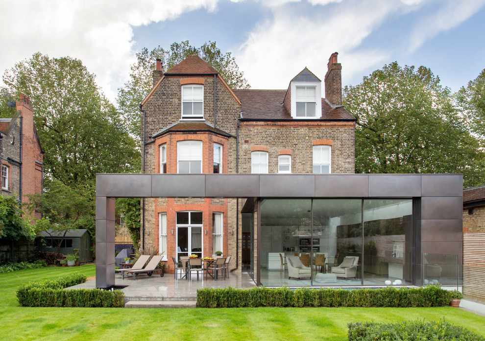 Photo of a large contemporary house exterior in London with three floors.