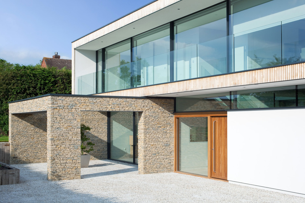 Contemporary two floor house exterior in Hampshire with wood cladding.