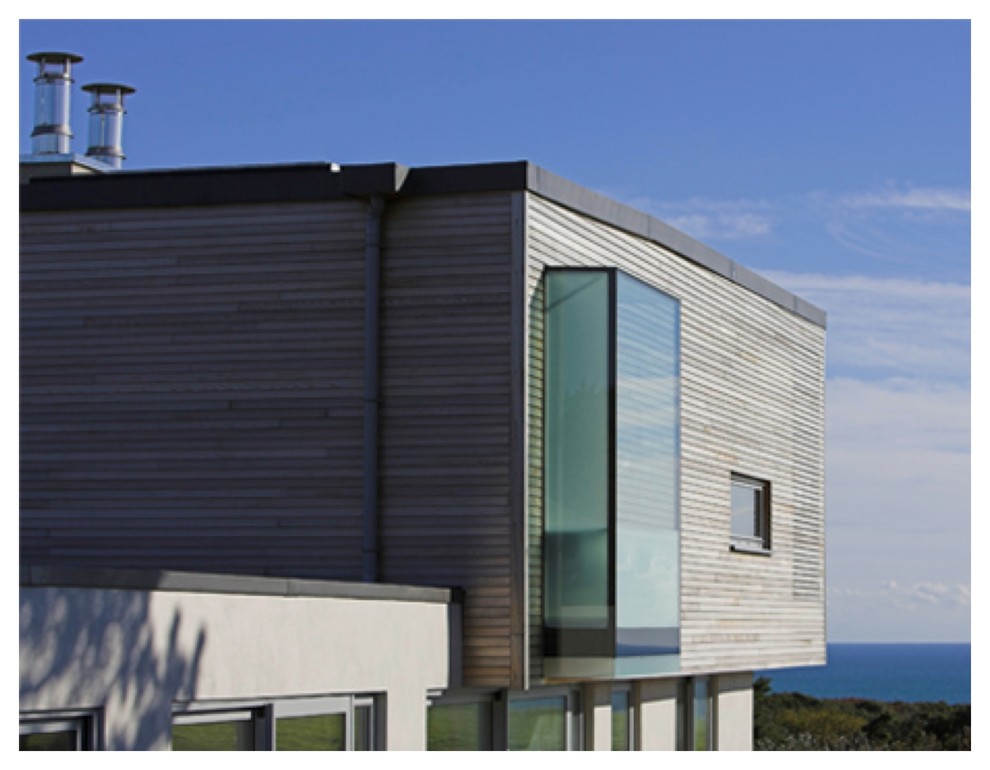This is an example of a contemporary house exterior in Channel Islands.