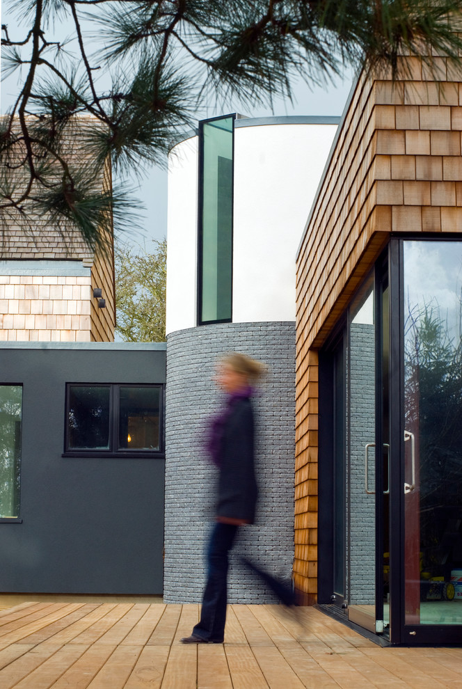 Photo of a contemporary house exterior in Channel Islands with mixed cladding.