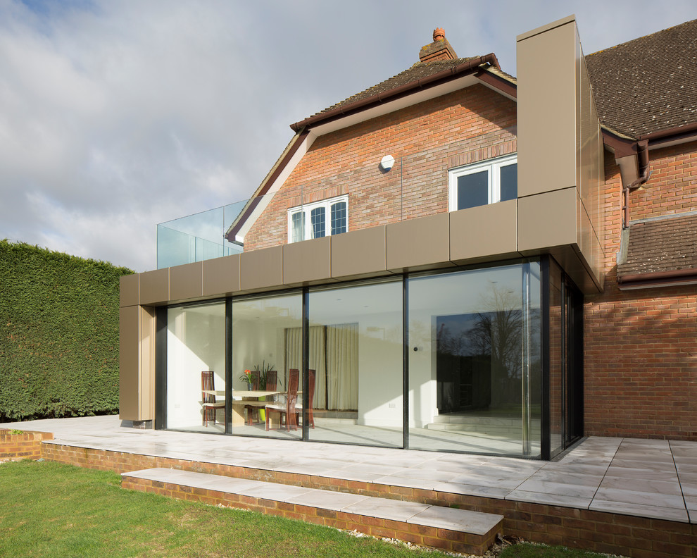Mid-sized contemporary exterior home idea in Surrey