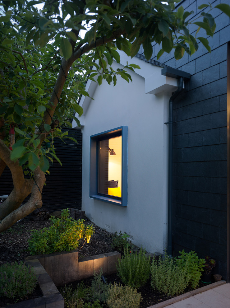 Gray three-story exterior home idea in Kent