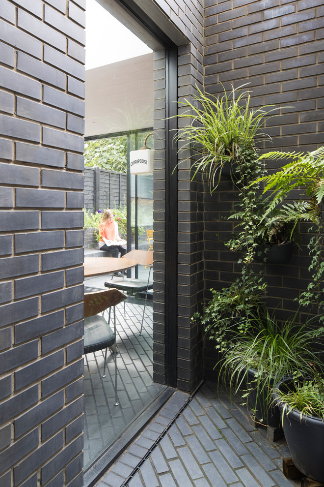 Black contemporary bungalow brick terraced house in London.