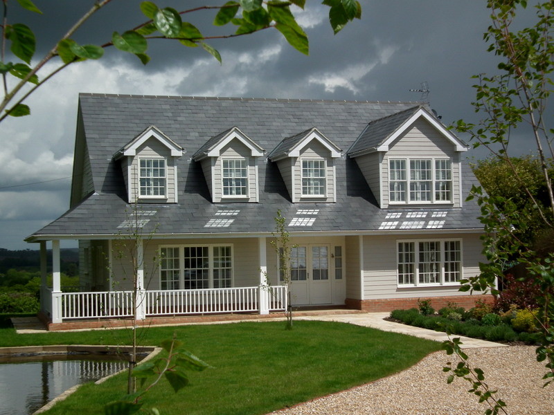 Design ideas for a classic two floor house exterior in Sussex with a pitched roof.