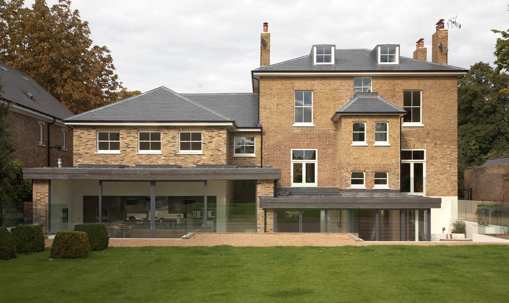 Design ideas for a large and brown contemporary brick house exterior in London with three floors and a hip roof.