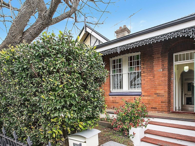 Inspiration for a small and red classic bungalow brick house exterior in Sydney.