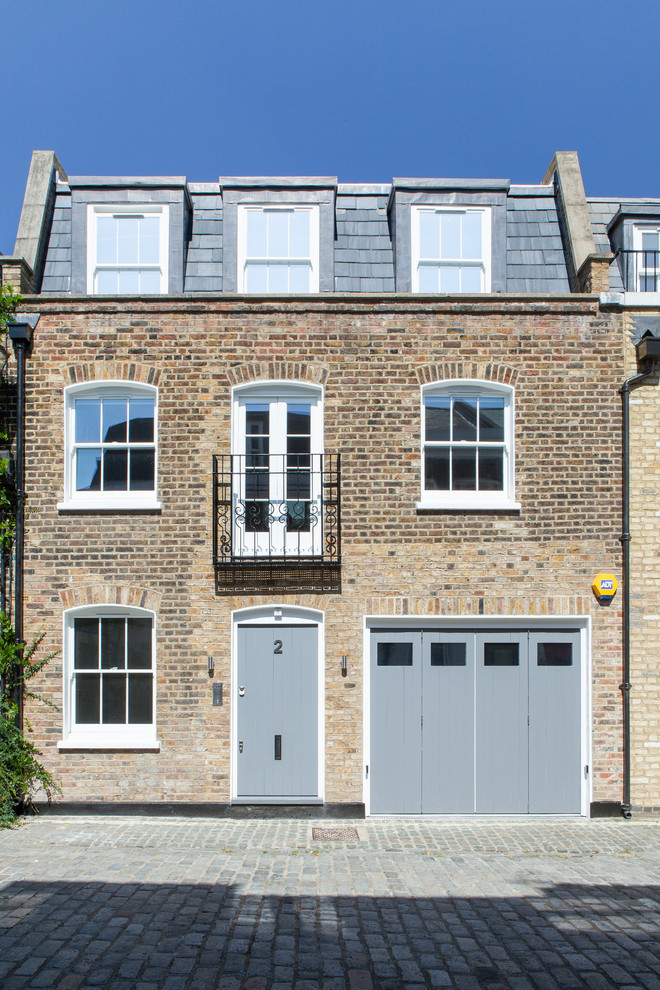 Photo of a contemporary brick house exterior in London with three floors.